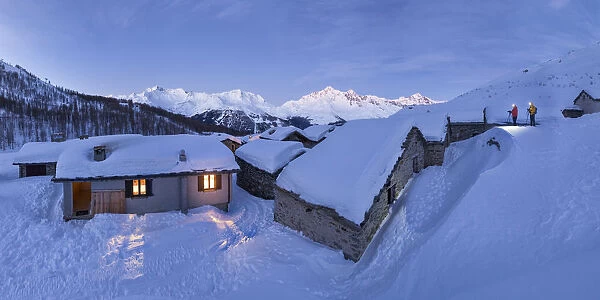 two photographers capture the sunrise in the historic village of Groppera, Valtellina