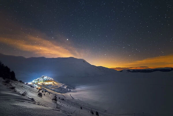 Pian Grande near Castelluccio di Norcia, in wintertime with snow, under a starry sky