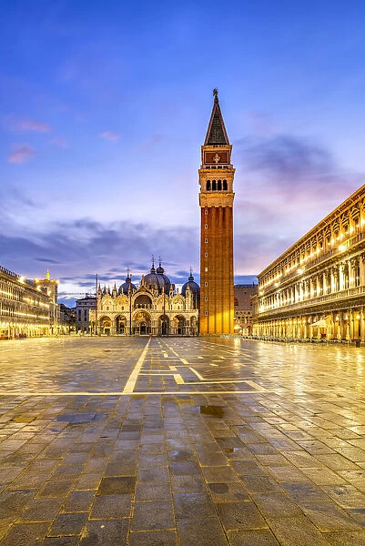 Piazza San Marco with St. Marks Campanile and Basilica at sunrise, Venice, Veneto, Italy