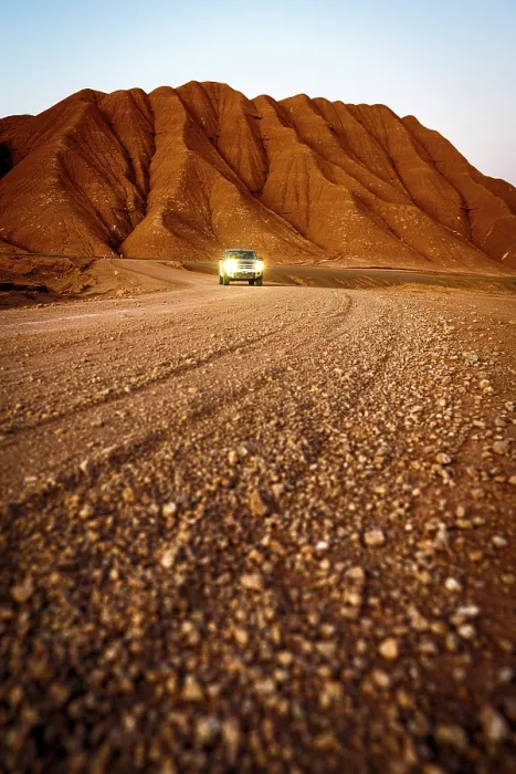 Framed Print : Pick-Up traveling at feet of red volcanic mountains, Labyrinth Desert, Puna, Argentina Framed Print : Pick-Up traveling at feet of red volcanic mountains, Labyrinth Desert, Puna, Argentina