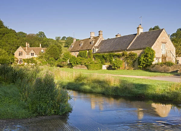 Picturesque farmhouses beside the River Eye in the Cotswolds village of Upper Slaughter