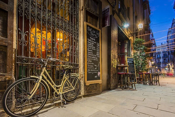 Picturesque night corner of Born neighborhood with tapas bar, Barcelona, Catalonia, Spain