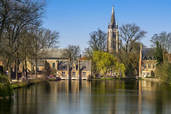 Picturesque view of the old town with belfry of Church of Our Lady in Bruges in the
