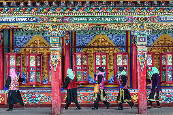 Pilgrims spinning prayer wheels at Wutun Si, (Lower Monastery), Longwu, China