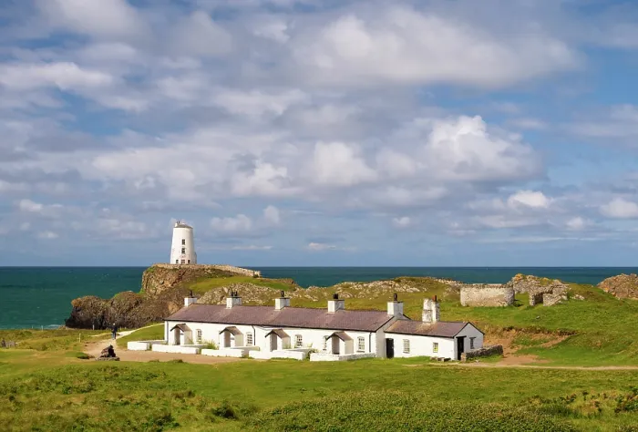 Framed Print : Pilots cottages and Twr Mawr lighthouse on Llanddwyn Island in Anglesey, Wales Framed Print : Pilots cottages and Twr Mawr lighthouse on Llanddwyn Island in Anglesey, Wales