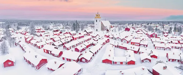 Framed Print : Pink arctic sunrise over the snowy red cottages and bell tower in the old Gammelstad Church Town, aerial view, Lulea, Sweden Framed Print : Pink arctic sunrise over the snowy red cottages and bell tower in the old Gammelstad Church Town, aerial view, Lulea, Sweden