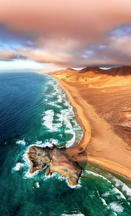 Framed Print : Pink clouds at sunset over the golden sand of Cofete beach and headland, Jandia Nature Park, Fuerteventura, Canary Islands Framed Print : Pink clouds at sunset over the golden sand of Cofete beach and headland, Jandia Nature Park, Fuerteventura, Canary Islands