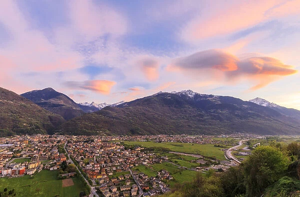 The pink sky at sunset frames the town of Morbegno province of Sondrio Lombardy Valtellina