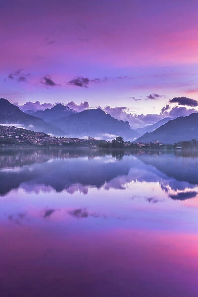 Pink sunrise on lake Annone, Brianza, Lecco province, Lombardy, Italy