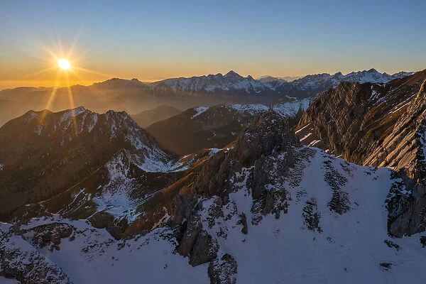 Pizzo Corzene and mountain range at sunset during winter, Castione della Pesolana, Prealpi Orobie, Bergamo, Lombardy, Italy