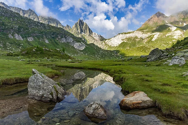 Pizzo Prevat mount reflection in a alpine stream near Capanna Leit, Valle Leventina