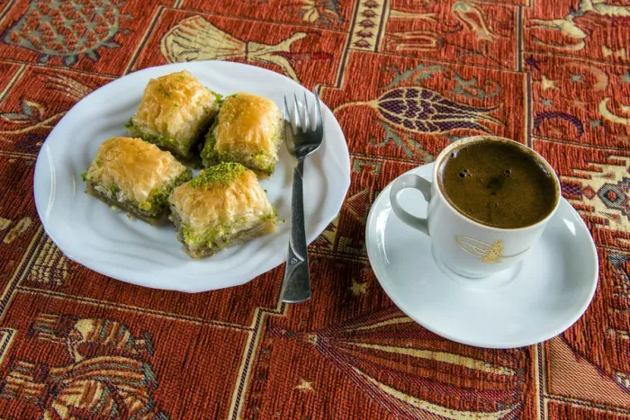 Framed Print : Plate with traditional baklava Turkish sweet and cup of Turkish coffee Framed Print : Plate with traditional baklava Turkish sweet and cup of Turkish coffee