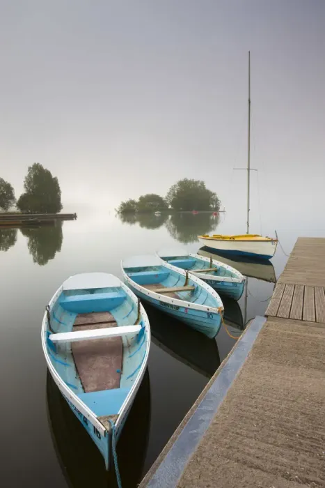 Framed Print : Pleasure boats moored at Llangorse Lake on a misty morning, Brecon Beacons National Park Framed Print : Pleasure boats moored at Llangorse Lake on a misty morning, Brecon Beacons National Park