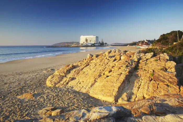 Framed Print : Plettenberg Bay beach at dawn with Beacon Island Hotel in background, Western Cape