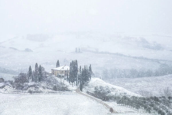 Podere Belvedere covered in snow during a rare winter blizzard in Val d Orcia