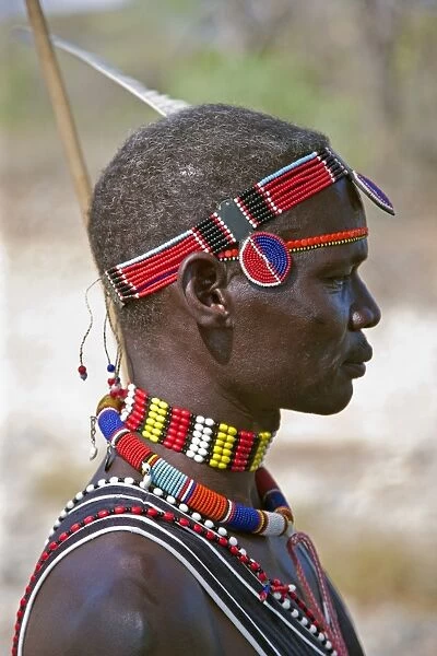 A Pokot man wearing typical beaded ornaments of his tribe. The Pokot are pastoralists speaking a Southern Nilotic