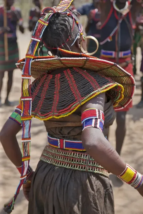 Framed Print : A Pokot woman in traditional attire dances to celebrate an Atelo ceremony Framed Print : A Pokot woman in traditional attire dances to celebrate an Atelo ceremony