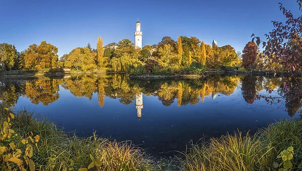 Pond in the castle park of Bad Homburg vor der Hoehe with white tower, Taunus, Hesse, Germany