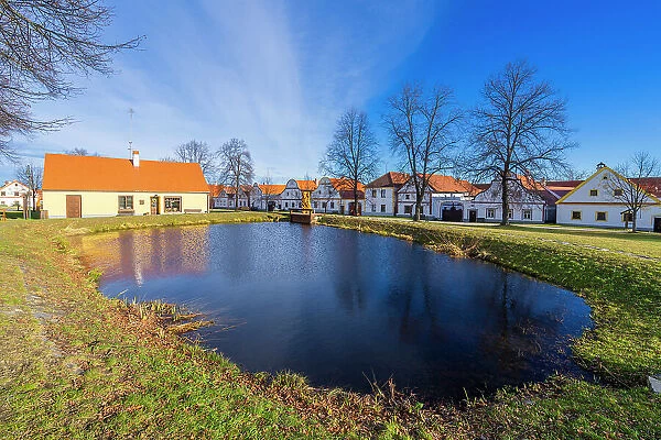 Pond in Holasovice and houses of rural Baroque, UNESCO, Jankov, Ceske Budejovice, South Bohemian Region, Czech Republic