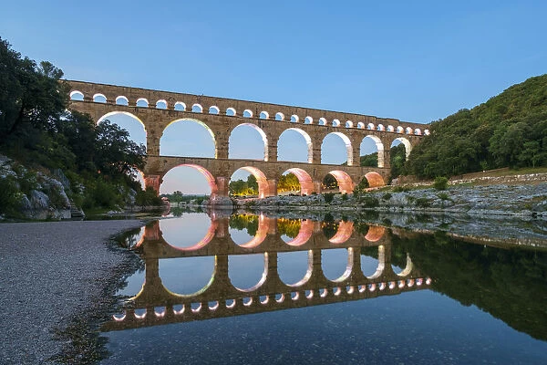 Pont du Gard Roman aqueduct over Gard River at dusk, Gard Department, Languedoc-Roussillon