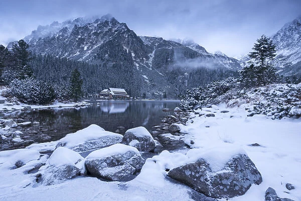Popradske Pleso lake and mountain cottage in wintertime, Slovakia, Europe