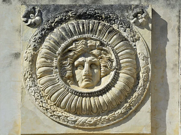 Detail of the Portico of the Roman Forum in Merida depicting Medusa. Spain