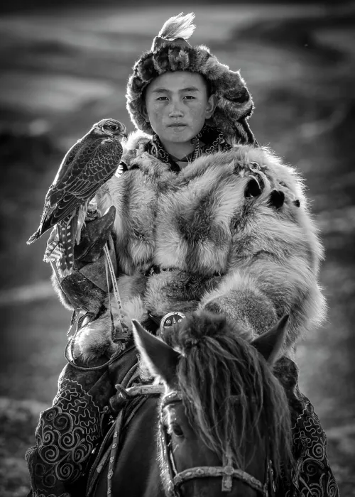 Framed Print : Portrait of a Kazakh boy on horseback wearing traditional fur clothing and holding his pet falcon, Western Mongolia, Asia Framed Print : Portrait of a Kazakh boy on horseback wearing traditional fur clothing and holding his pet falcon, Western Mongolia, Asia