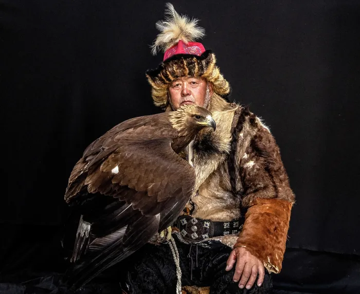 Framed Print : Portrait of a Kazakh Eagle Hunter wearing traditional fur clothing and posing with his trained golden eagle, Bayan-Ulgii Province, Western Mongolia, Asia Framed Print : Portrait of a Kazakh Eagle Hunter wearing traditional fur clothing and posing with his trained golden eagle, Bayan-Ulgii Province, Western Mongolia, Asia
