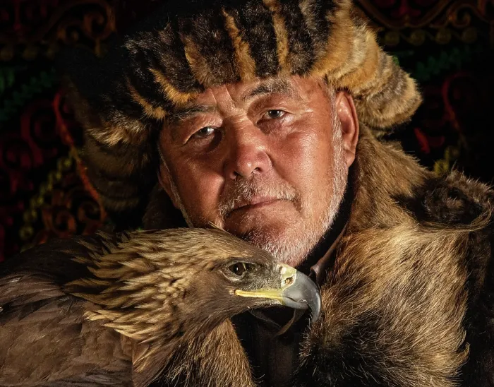 Framed Print : Portrait of a Kazakh Eagle Hunter wearing traditional fur clothing and posing with his trained golden eagle, Bayan-Ulgii Province, Western Mongolia, Asia Framed Print : Portrait of a Kazakh Eagle Hunter wearing traditional fur clothing and posing with his trained golden eagle, Bayan-Ulgii Province, Western Mongolia, Asia
