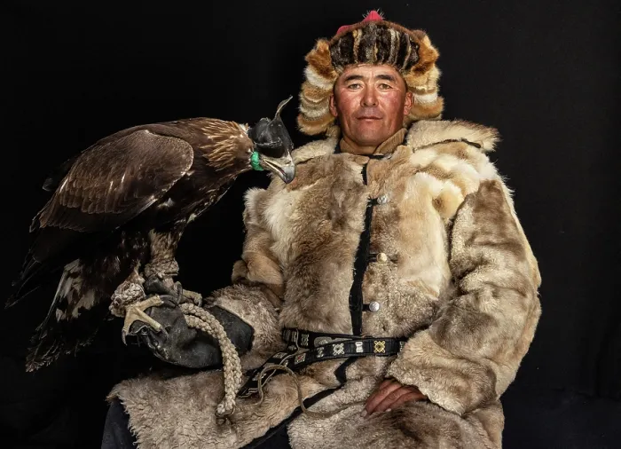 Framed Print : Portrait of a Kazakh Eagle Hunter wearing traditional fur clothing and posing with his trained golden eagle, Bayan-Ulgii Province, Western Mongolia, Asia Framed Print : Portrait of a Kazakh Eagle Hunter wearing traditional fur clothing and posing with his trained golden eagle, Bayan-Ulgii Province, Western Mongolia, Asia
