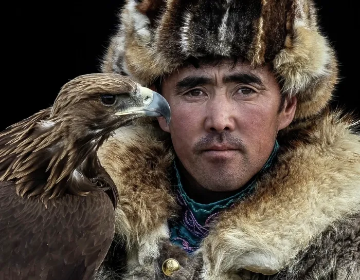 Framed Print : Portrait of a Kazakh Eagle Hunter wearing traditional fur clothing and posing with his trained golden eagle, Bayan-Ulgii Province, Western Mongolia, Asia Framed Print : Portrait of a Kazakh Eagle Hunter wearing traditional fur clothing and posing with his trained golden eagle, Bayan-Ulgii Province, Western Mongolia, Asia