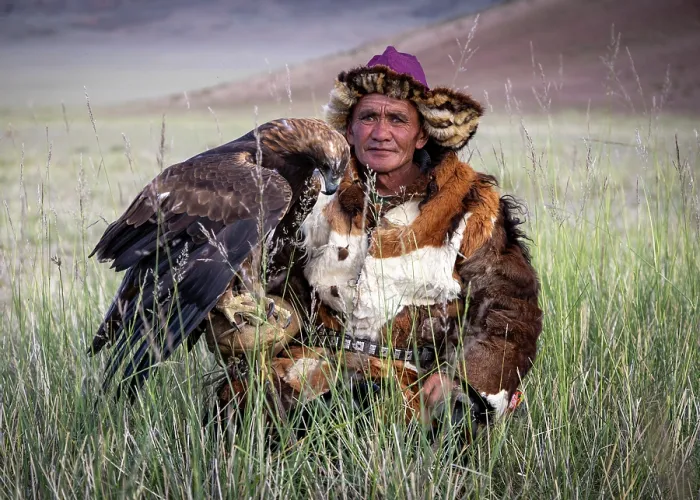 Framed Print : Portrait of a Kazakh Eagle Hunter wearing traditional fur clothing and posing with his trained golden eagle, Bayan-Ulgii Province, Western Mongolia, Asia Framed Print : Portrait of a Kazakh Eagle Hunter wearing traditional fur clothing and posing with his trained golden eagle, Bayan-Ulgii Province, Western Mongolia, Asia