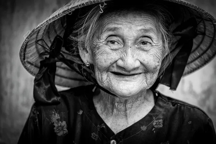 Framed Print : Portrait of an old lady wearing traditional conical hat, Hoi An, Central Vietnam Framed Print : Portrait of an old lady wearing traditional conical hat, Hoi An, Central Vietnam