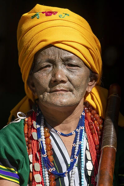 Portrait of a woman with traditional tattooed face in Mindat, Chin State, Myanmar