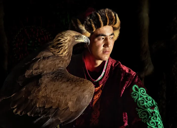 Framed Print : Portrait of a young Kazakh Eagle Hunter wearing traditional fur clothing and posing with his trained golden eagle, Bayan-Ulgii Province, Western Mongolia, Asia Framed Print : Portrait of a young Kazakh Eagle Hunter wearing traditional fur clothing and posing with his trained golden eagle, Bayan-Ulgii Province, Western Mongolia, Asia