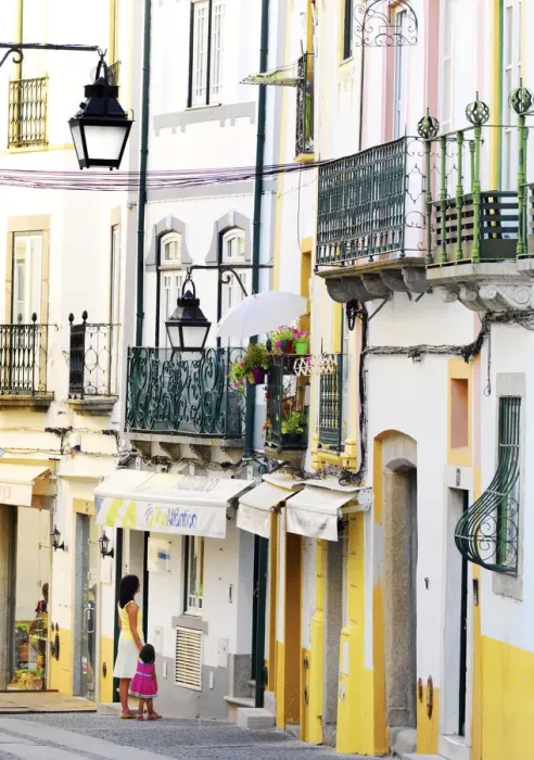 Framed Print : Portugal, Alentejo, EvoraWoman and girl looking in shop window (MR) Framed Print : Portugal, Alentejo, EvoraWoman and girl looking in shop window (MR)