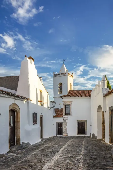Framed Print : Portugal, Alentejo, Monsaraz. Cobbled streets leading to the bell tower gateway of Framed Print : Portugal, Alentejo, Monsaraz. Cobbled streets leading to the bell tower gateway of
