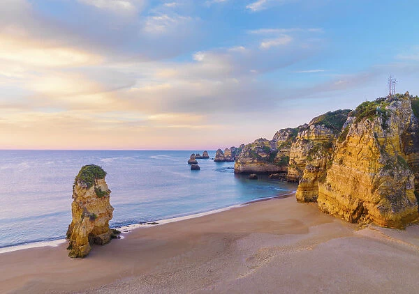 Portugal, Algarve, Lagos; Praia da Dona Ana, rock formations at dawn