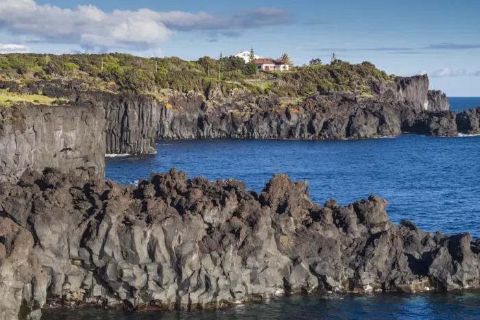 Framed Print : Portugal, Azores, Sao Jorge Island, Cais da Urzelina, volcanic rock coastline