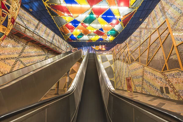 Portugal, Lisbon. Escalators and the colorful decorations at Olaias subway station