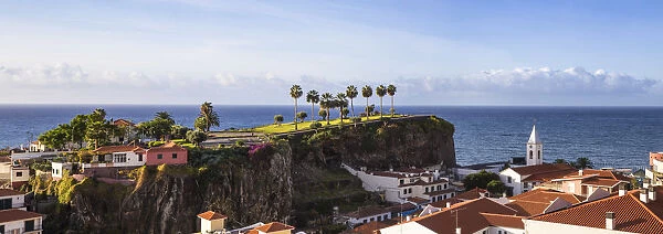 Portugal, Madeira, Funchal, View of Camara de Lobos beneath Ilheu gardens