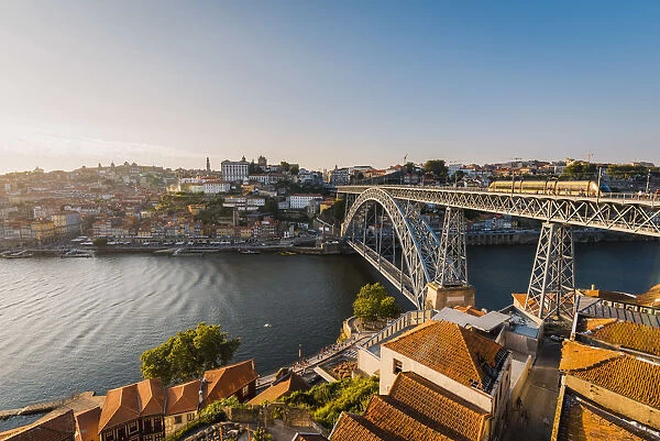 Portugal, Norte region, Porto (Oporto). Dom Luis I bridge and Douro river at sunset
