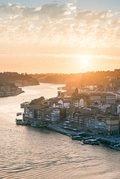 Portugal, Norte region, Porto (Oporto). Ribeira district and Douro river at sunset
