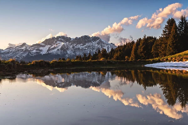 The Presolana is reflected at sunset, Seriana valley in Bergamo province, Lombardy