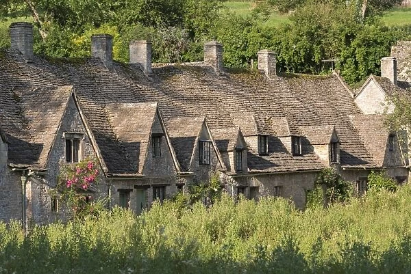 Pretty cottages at Arlington Row in the Cotswolds village of Bibury, Gloucestershire, England