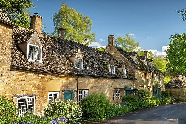 Pretty cottages in the idyllic Cotswold village of Snowshill, Gloucestershire, England. Spring (May) 2021