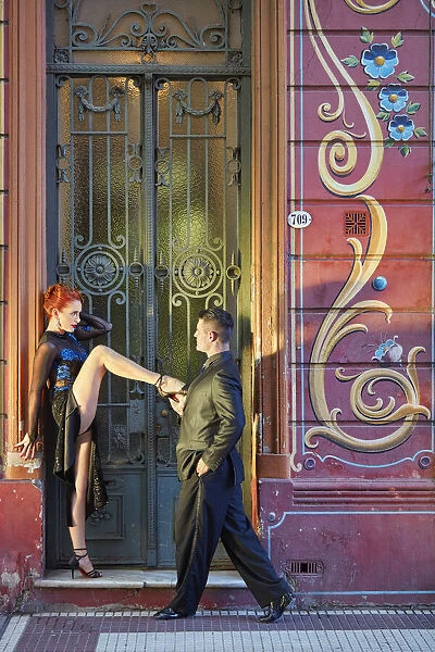 Professional Tango Dancers with 'Filieteado Art'in the background, Jean Jaures street, Abasto, Buenos Aires, Argentina. (MR)