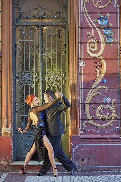 Professional Tango Dancers with 'Filieteado Art'in the background, Jean Jaures street, Abasto, Buenos Aires, Argentina. (MR)
