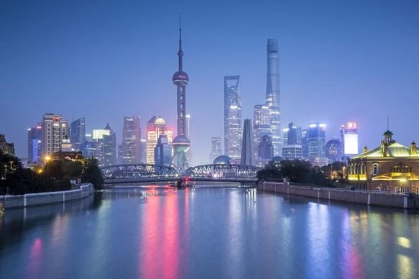 Pudong skyline across the Suzhou Creek and Waibaidu bridge, Shanghai, China