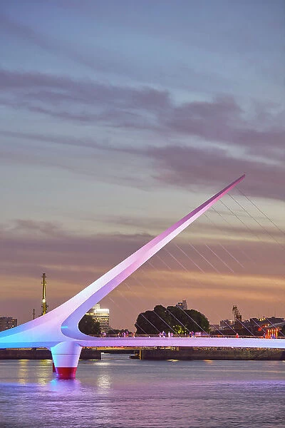 The 'Puente de la Mujer' bridge with a special illumination at twilight, Puerto Madero, Buenos Aires, Argentina